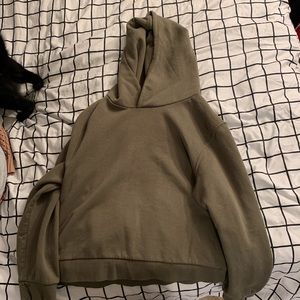a olive green cropped hoodie size L